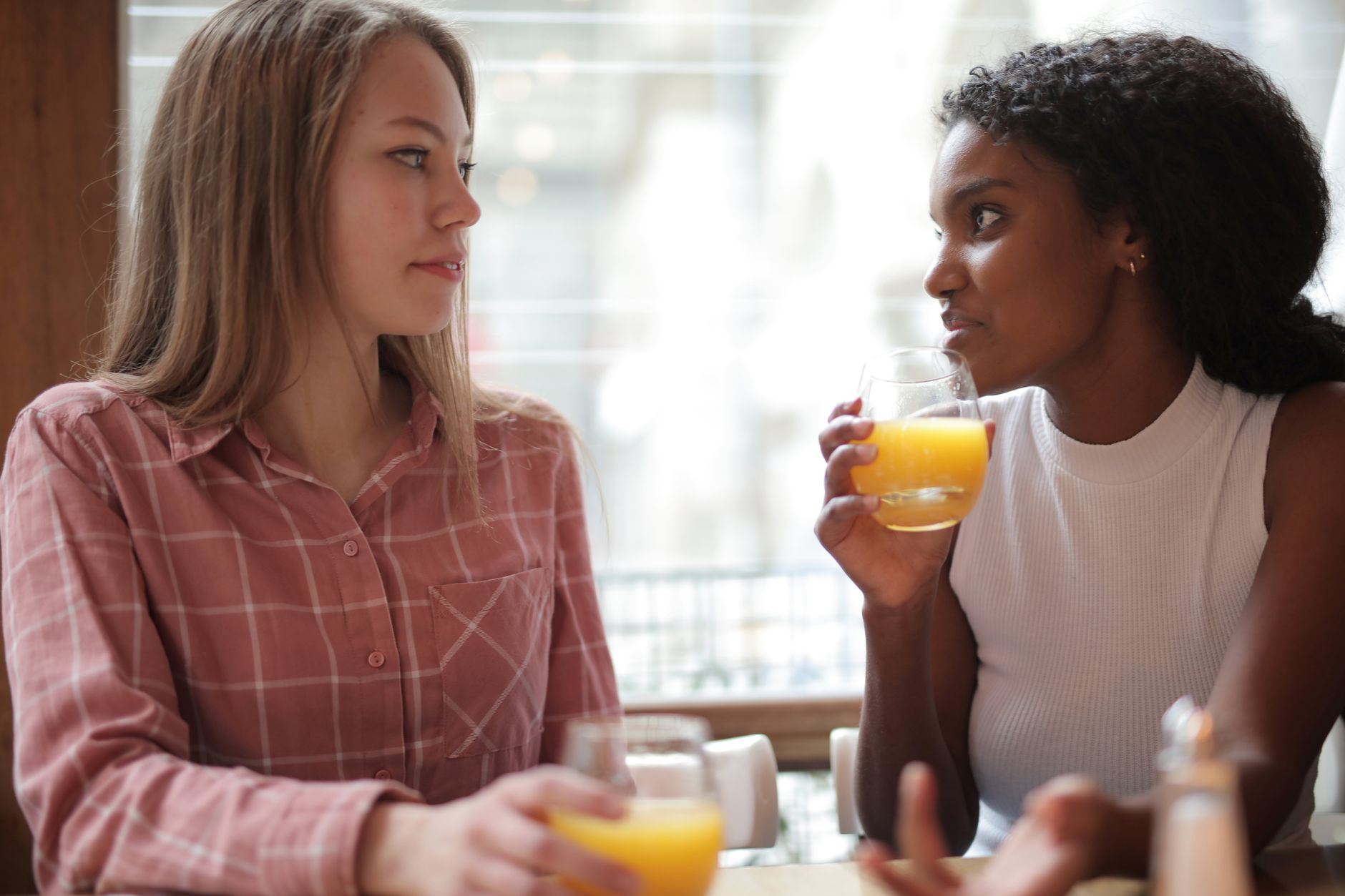 Two people talking across a table