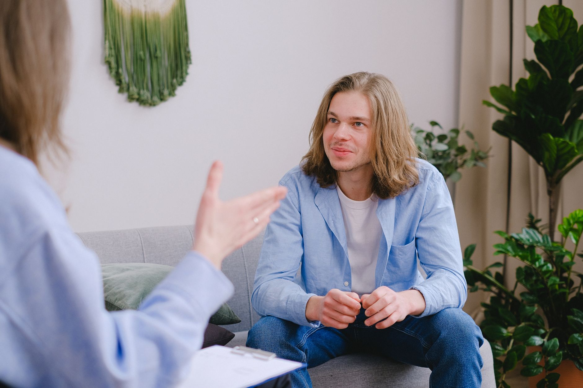 An adult in conversation with a clinician
