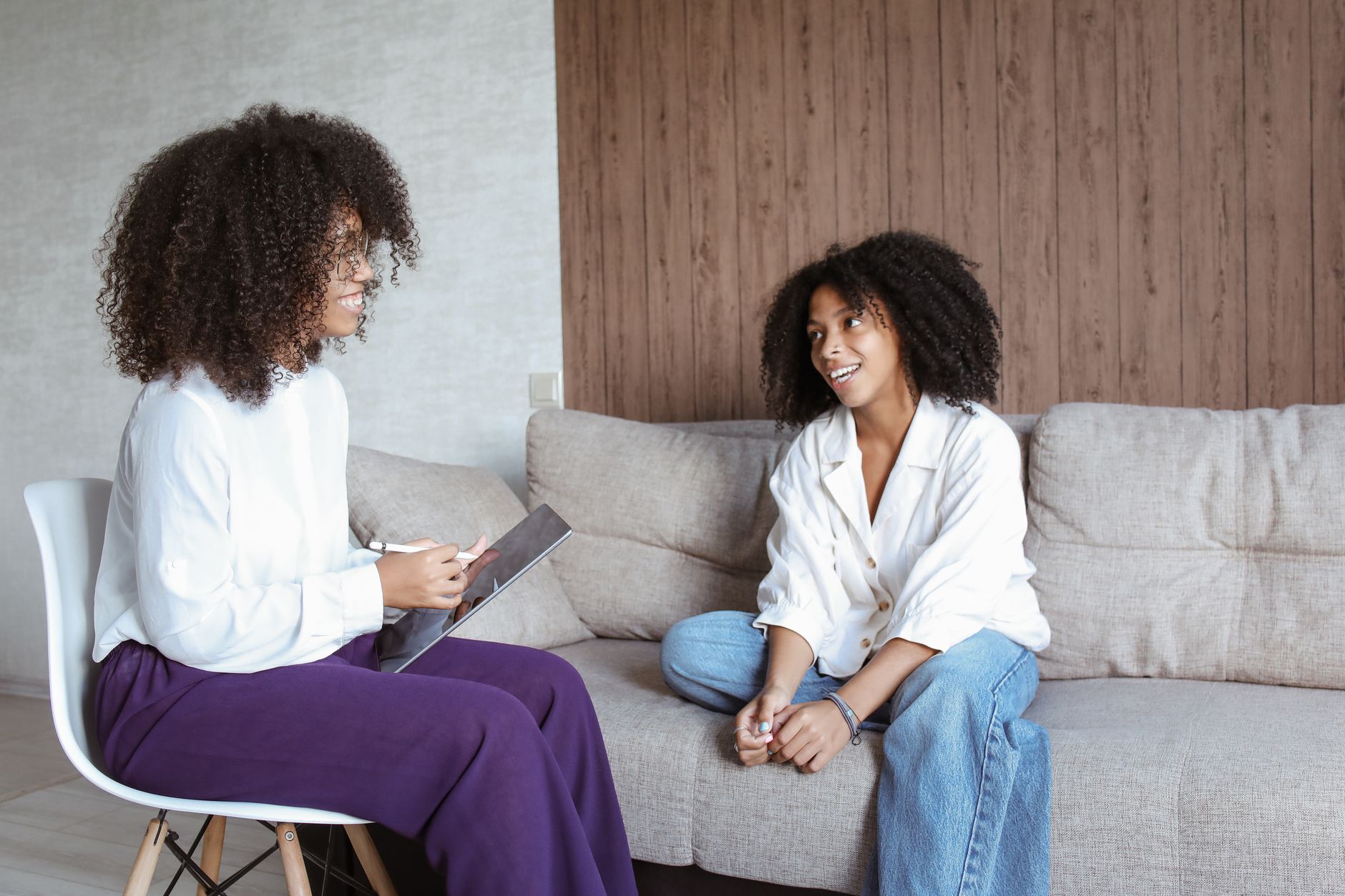 A patient talking with a clinician during a session