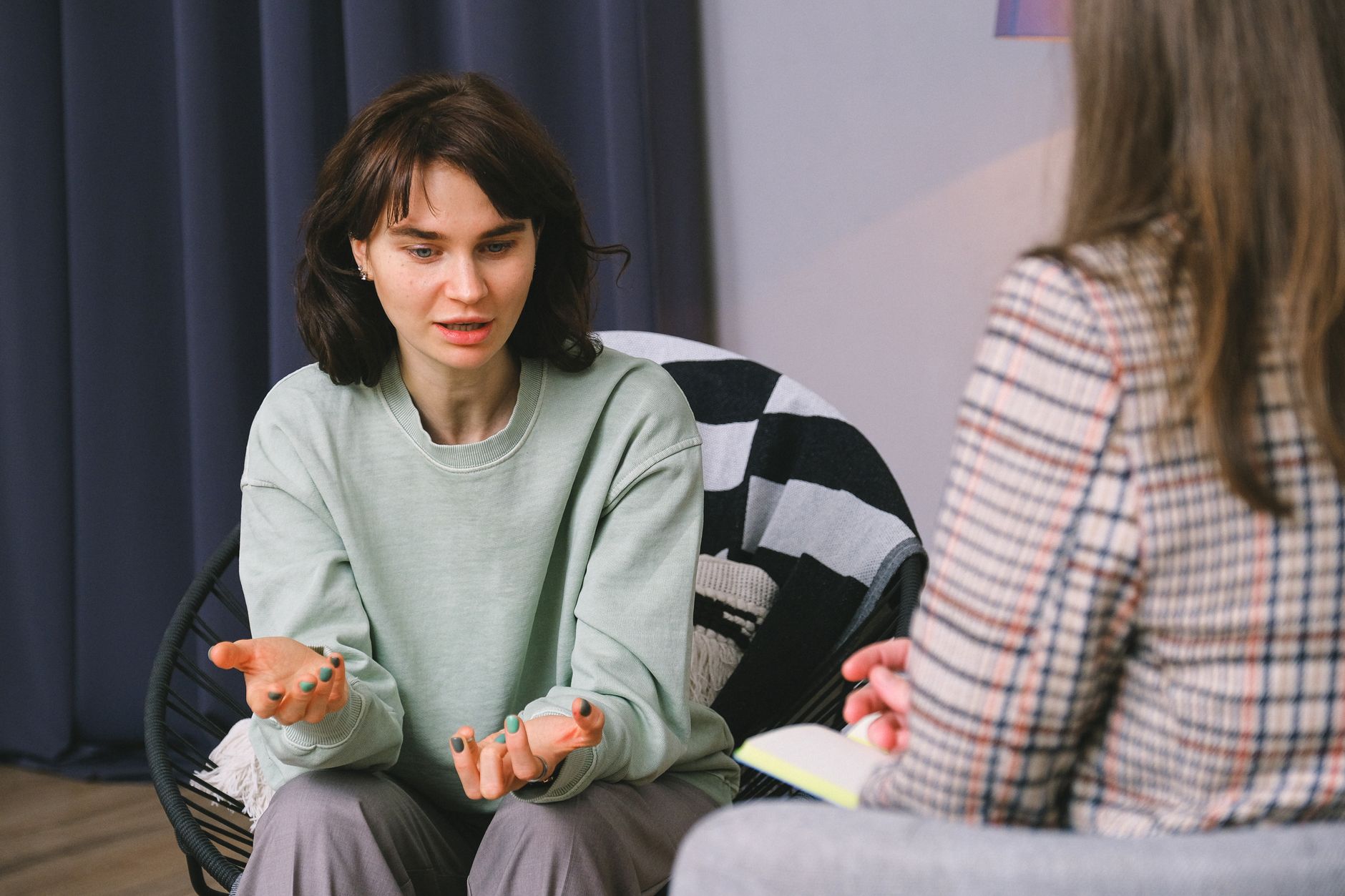 A patient talking with a clinician during a consultation