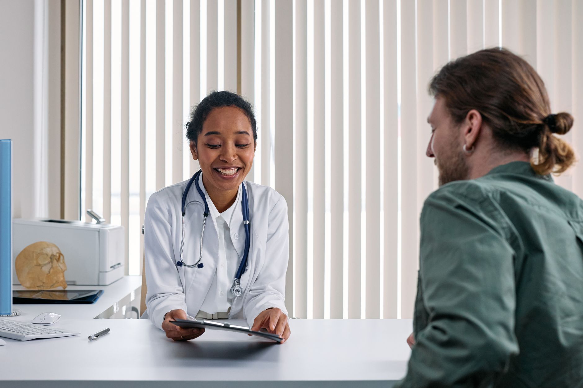 A clinician meeting with a patient